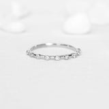 Elegant Distance Setting Diamond Ring with 9 round diamonds on 14k White Gold