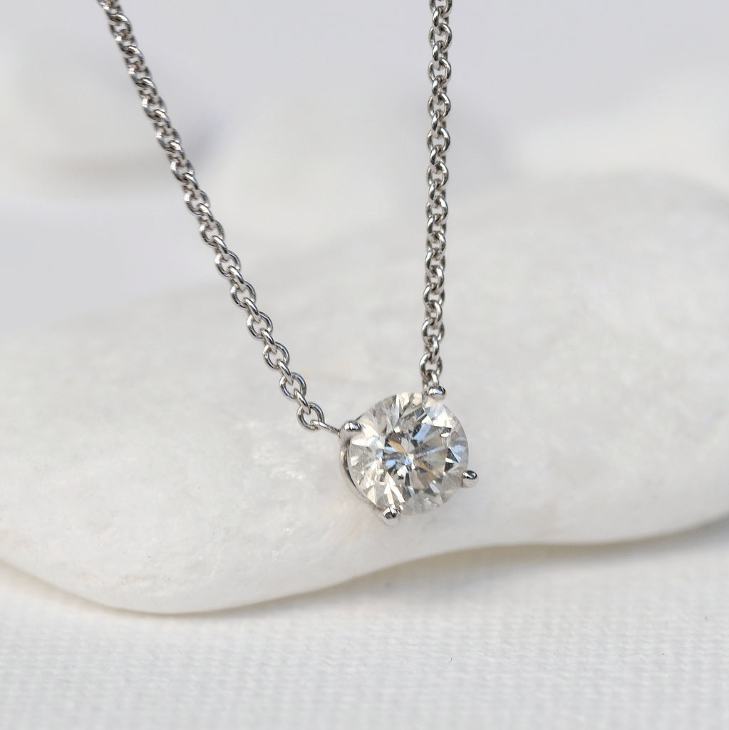 Classic ever-lasting single stone necklace featuring a stunning round diamond on 14k yellow gold necklace