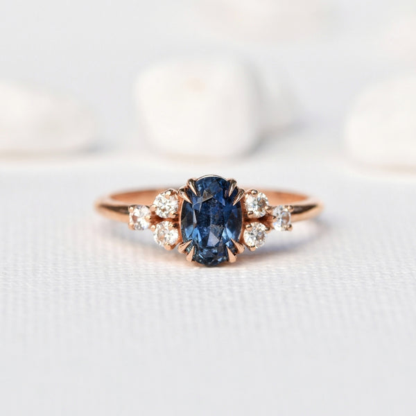 1.47ct Oval Blue Sapphire Ring in 14k Rose Gold 6-Stone Cluster Setting