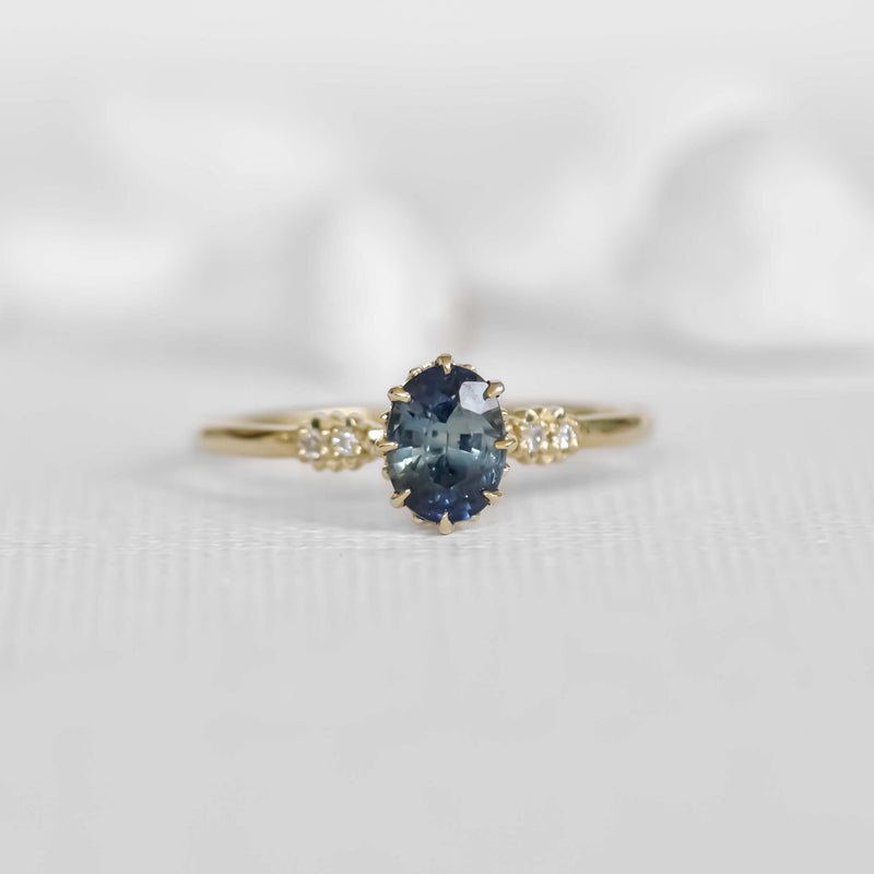 solitaire yellowish blue oval sapphire engagement ring